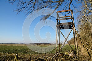 Hunting tower by a field