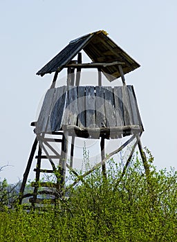 Hunting tower in the forest for wildlife viewing and hunting