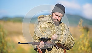 Hunting and trapping seasons. Hunting masculine hobby. Man brutal gamekeeper nature background. Bearded hunter spend