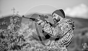 Hunting and trapping seasons. Hunting masculine hobby. Man brutal gamekeeper nature background. Hunter hold rifle