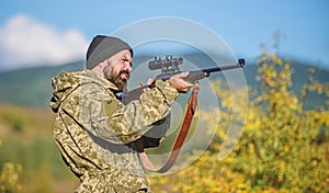 Hunting and trapping seasons. Hunting masculine hobby. Man brutal gamekeeper nature background. Hunter hold rifle