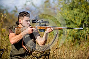 Hunting weapon gun or rifle. Hunting target. Looking at target through sniper scope. Man hunter aiming rifle nature