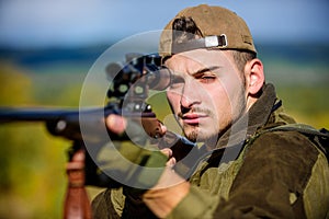 Hunting weapon gun or rifle. Man hunter aiming rifle nature background. Hunting skills and weapon equipment. Hunting
