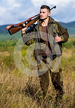 Hunting weapon gun or rifle. Man hunter carry rifle nature background. Experience and practice lends success hunting