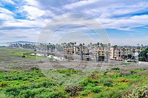 Huntington Beach California scenic landscape with pond grass land and buildings