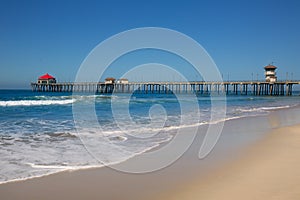 Huntington beach Pier Surf City USA with lifeguard tower photo