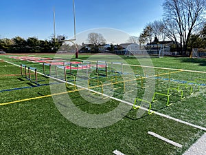 Hurdles set up on a field for stength and agility practice