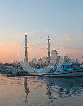 Hurgada Egypt fishery marina and mosque at dusk photo