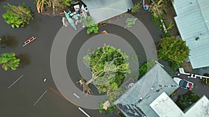 Hurricane Ian flooded house and fallen tree in Florida residential area. Natural disaster and its consequences