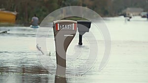 Hurricane Ian flooded street with mail box surrounded with water in Florida residential area. Consequences of natural