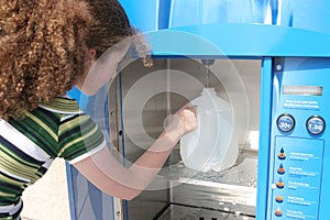 Hurricane Preparedness - Girl Fills Bottle