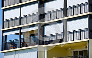 Hurricane shutters on large building