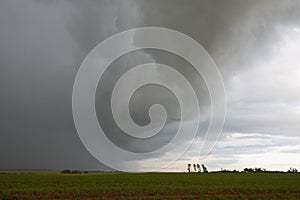 Hurricane in the sky over the field