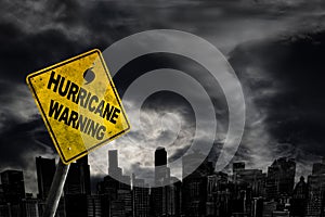 Hurricane Warning Sign Against City Silhouette With Copy Space