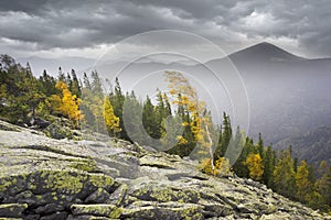 Hurricane wind in autumn mountains