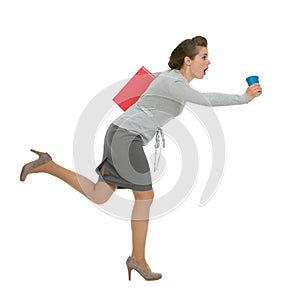 Hurry business woman with folder and cup running