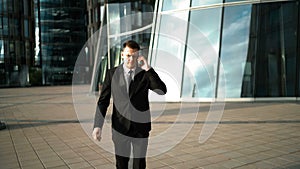 Hurry businessman with smartphone