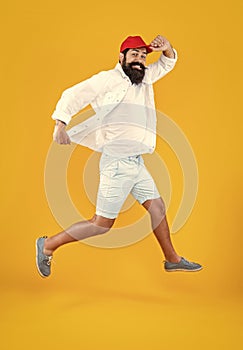 hurrying man deliveryman isolated on yellow. hurrying man deliveryman in studio.