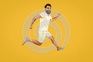 hurrying man isolated on yellow. hurrying man in studio. hurrying man on background.