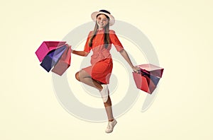 hurrying teen shopper girl on background. photo of teen shopper girl with shopping bags.
