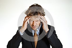 Hurting businessman with migraine