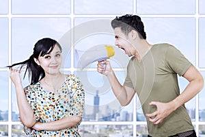 Husband angry at wife using megaphone