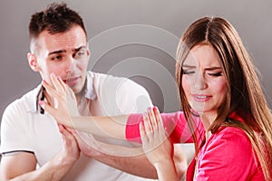 Husband apologizing wife. Angry upset woman.