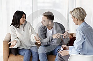 Husband Blaming Cheating Wife During Couples Therapy Session Indoor