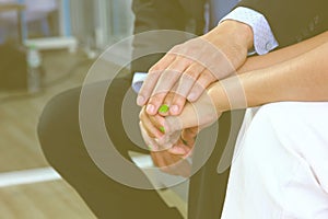 The husband encouraged his wife by holding hands.after  talking with a psychologist at the clinic