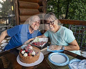 Husband enjoying his 75th birthday celebration with his wife..