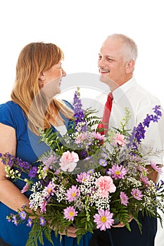 Husband Gives Flowers to His Wife