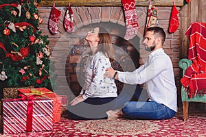 Husband giving his wife back massage at home