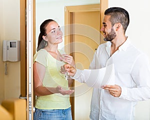 Husband giving the keys to apartment