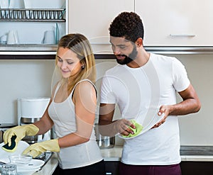 Husband helping girl doing clean up