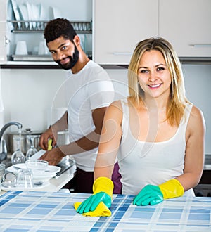 Husband helping girl doing clean up