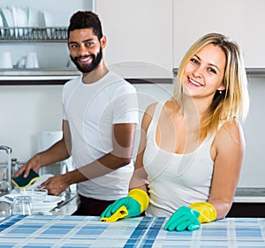 Husband helping girl doing clean up