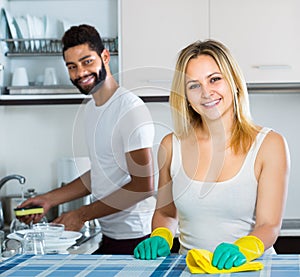 Husband helping girl doing clean up