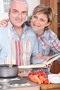 Husband looking at a cookbook