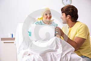 The husband looking after wife in hospital