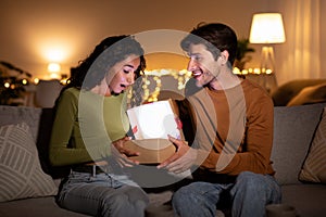 Husband Opening Gift Box Showing To Wife Birthday Gift Indoor