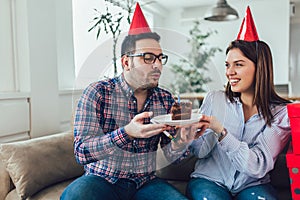 Husband`s birthday.Wife surprise his husband with birthday cake