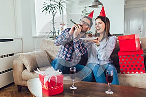 Husband`s birthday.Wife surprise his husband with birthday cake