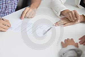 Husband signing divorce decree giving permission to marriage dis