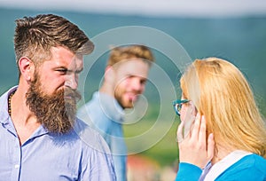 Husband strictly watching his wife looking at another guy while walk. Jealous concept. Passerby smiling to lady. Man