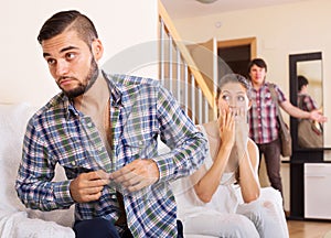 Husband watching how partner is cheating