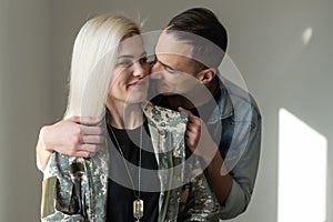 Husband Welcoming Wife Home On Army Leave