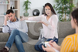 husband and wife arguing during couples therapy