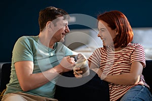 Husband and wife communicate, drink coffee. Cheerful joyful conversations, friendly chat talk