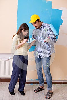 The husband and wife doing renovation at home