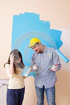 The husband and wife doing renovation at home